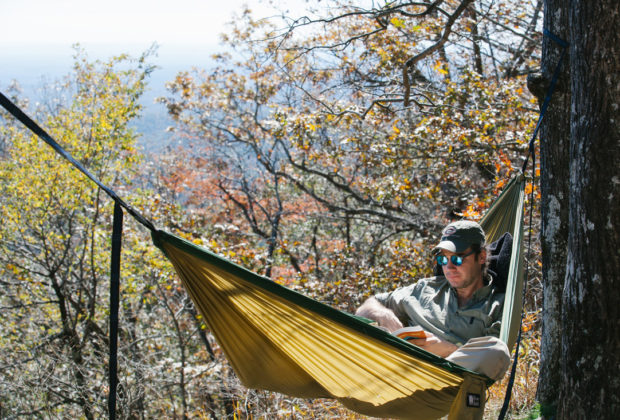 The author takes a book break along the Benton MacKaye Trail.